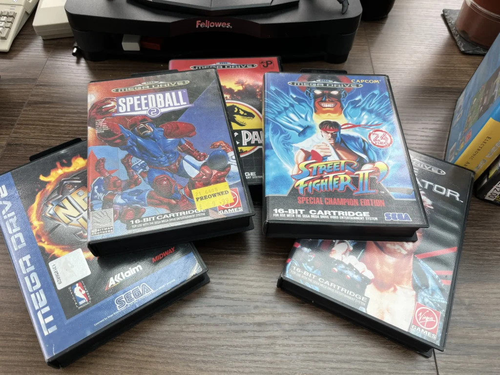 physical media 
A grouped layout of four classic 16-bit Sega Mega Drive game cartridges.